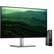 The image features a large computer monitor, likely a Dell computer, sitting on a desk. The monitor is displaying a beautiful image of a forest, with trees and mountains visible on the screen. The monitor is positioned next to a small computer tower, creating a complete computer setup.