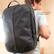 The text on the image reads "THULE Side access to laptop and tablet pockets."
