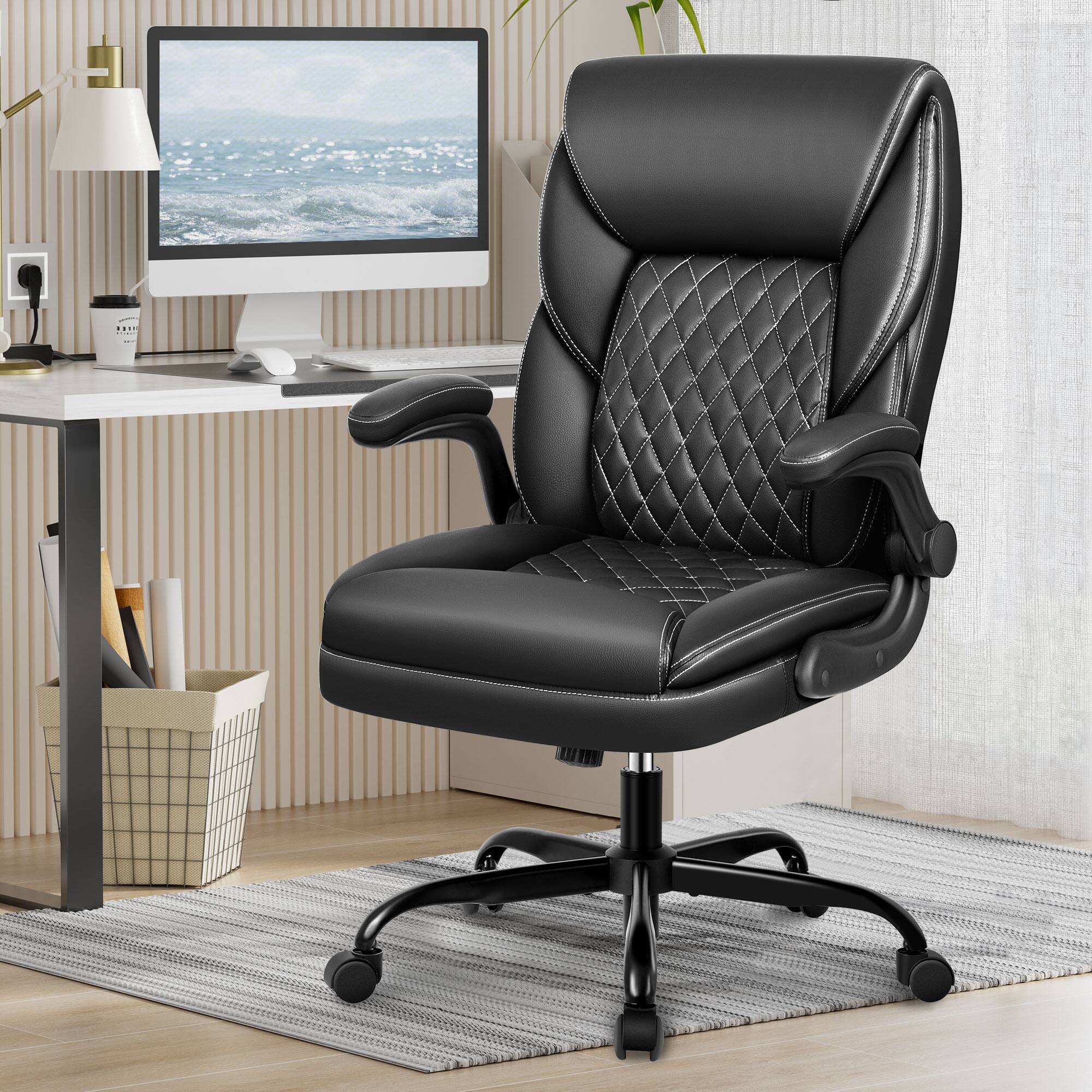 The image shows a modern office setup with the following items:

1. A black leather office chair with a quilted design and armrests.
2. A white desk with a computer monitor displaying an ocean scene.
3. A white desk lamp.
4. A white mug with text on it.
5. A small black device (possibly a speaker or a webcam).
6. A basket with office supplies.
7. A plant in the background.
8. A striped wall and a light-colored rug on the floor.