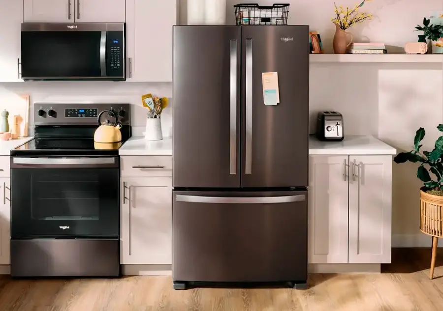 The text on the image is unrelated to the image content, which features a kitchen with a refrigerator, oven, microwave, and other appliances. The text does not provide any context or information about the kitchen.