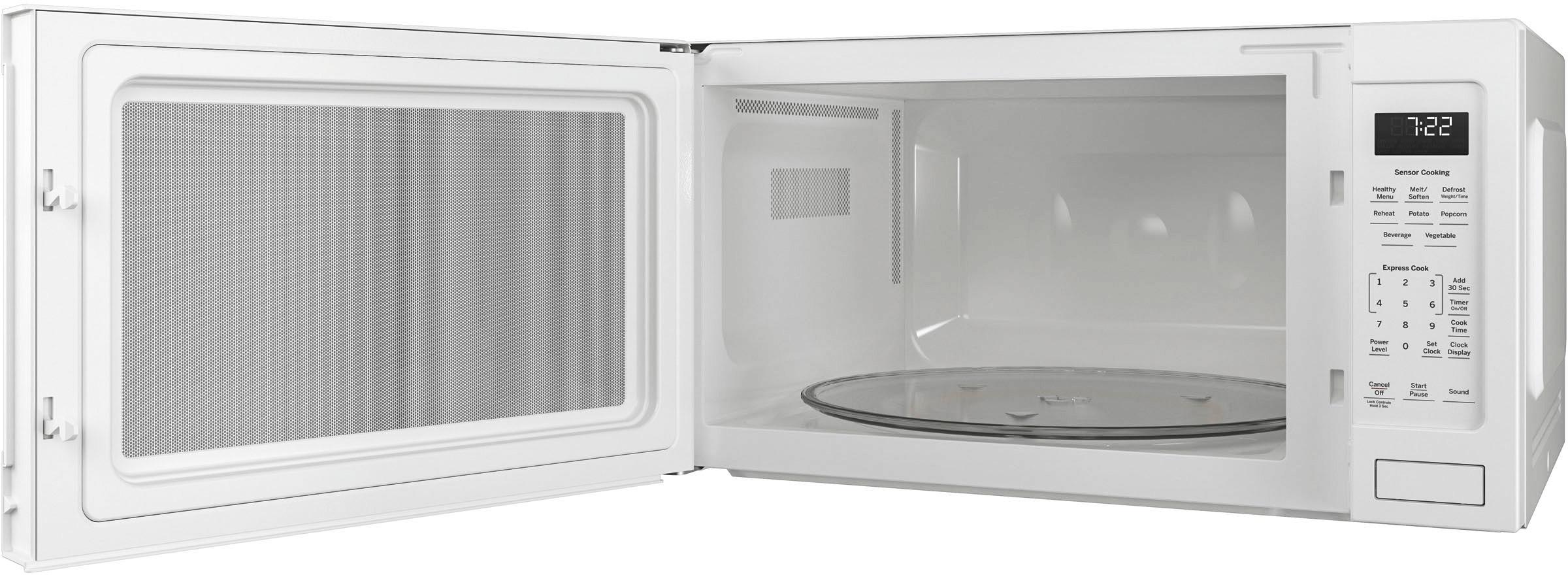 Left View: GE Profile - 2.2 Cu. Ft. Microwave - White on white