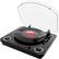 The image features a turntable with a record on it, which is placed on a table. The turntable has a clear plastic cover, and the record is positioned on the turntable's surface. The turntable is a part of a record player, and it is designed to play and reproduce music from vinyl records.