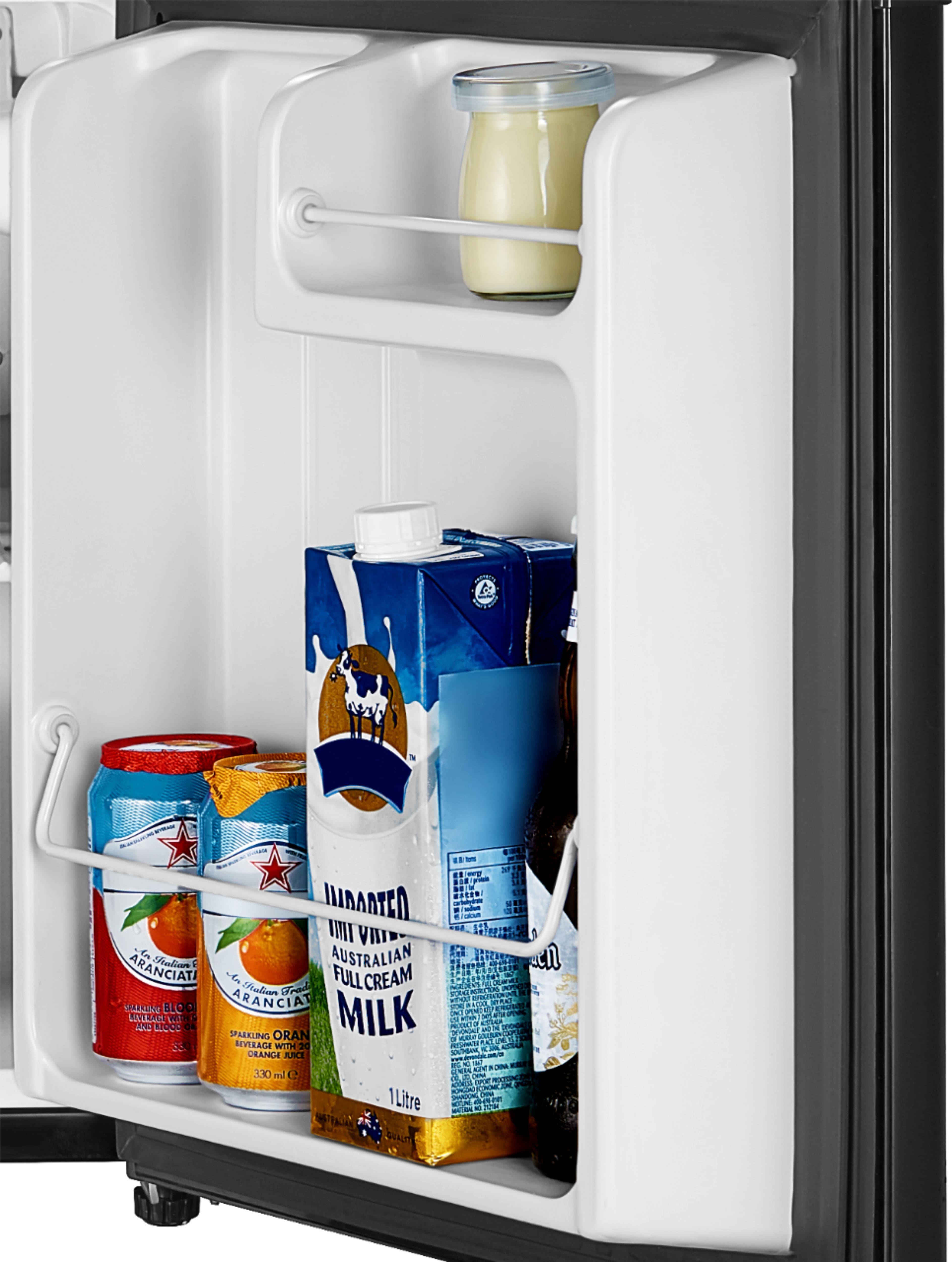 The text on the image reads:
"Milk, orange juice, and soda in a mini refrigerator."