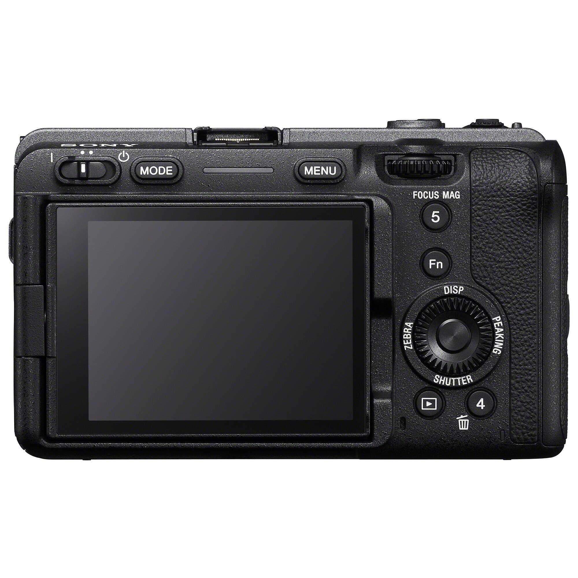 The image shows a black camera with a screen on the front. The camera has a menu button, a mode button, a focus button, and a shutter button. Additionally, there is a mag button and a zebra button. The camera also has a display screen that shows the camera's settings.