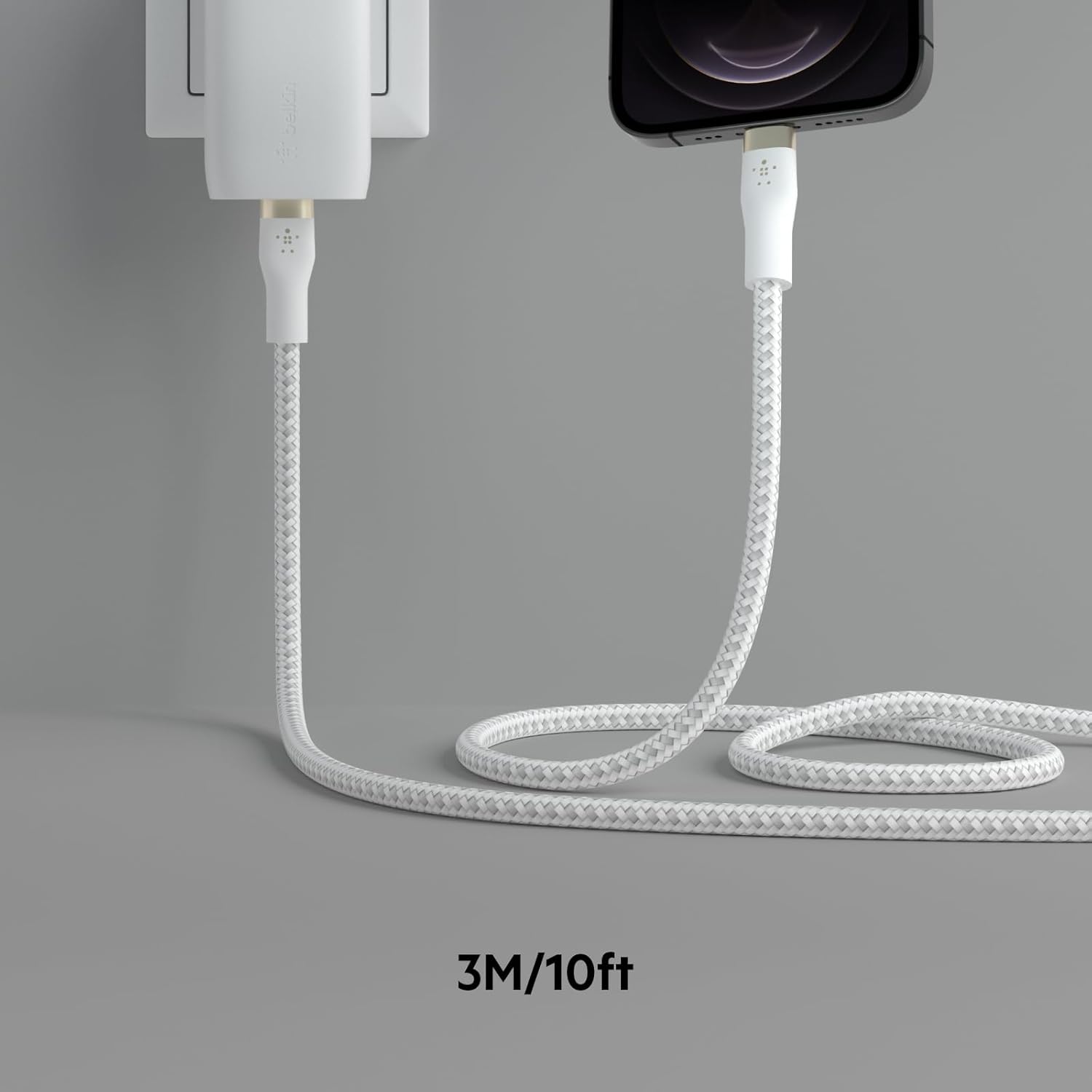 The text on the image reads "bella 3M/10ft," which is likely meant to say "bella 3M/10ft." The text is describing a white cord, possibly a charger or a camera, that is 3 meters (10 feet) long.