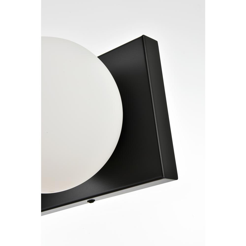 Angle. Living District - Jaylin 3 light Black and frosted white Bath Sconce - Black And Frosted White.
