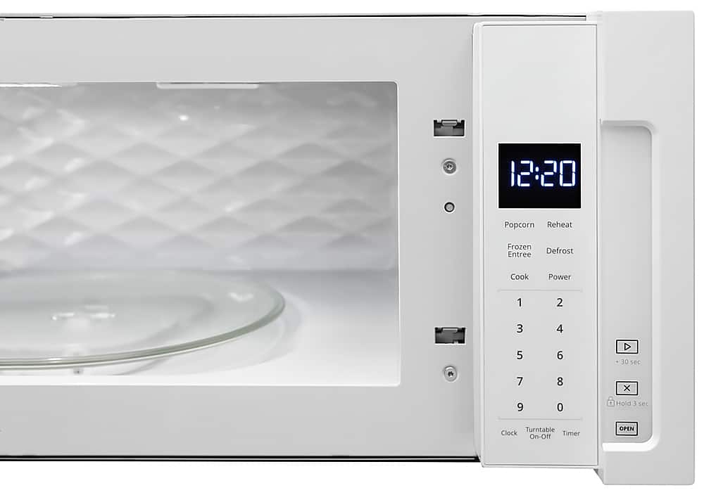 The text on the image reads: "12:20 Popcorn Reheat Frozen Entree Defrost Cook Power 1 2 3 4 5 6 D 30 sec 7 8 x 9 0 1 Hold E sec Turntable Clock Timer On-Off OPEN."
Corrected text: "12:20 Popcorn Reheat Frozen Entree Defrost Cook Power 1 2 3 4 5 6 D 30 sec 7 8 9 0 1 Hold E sec Turntable Clock Timer On-Off OPEN."