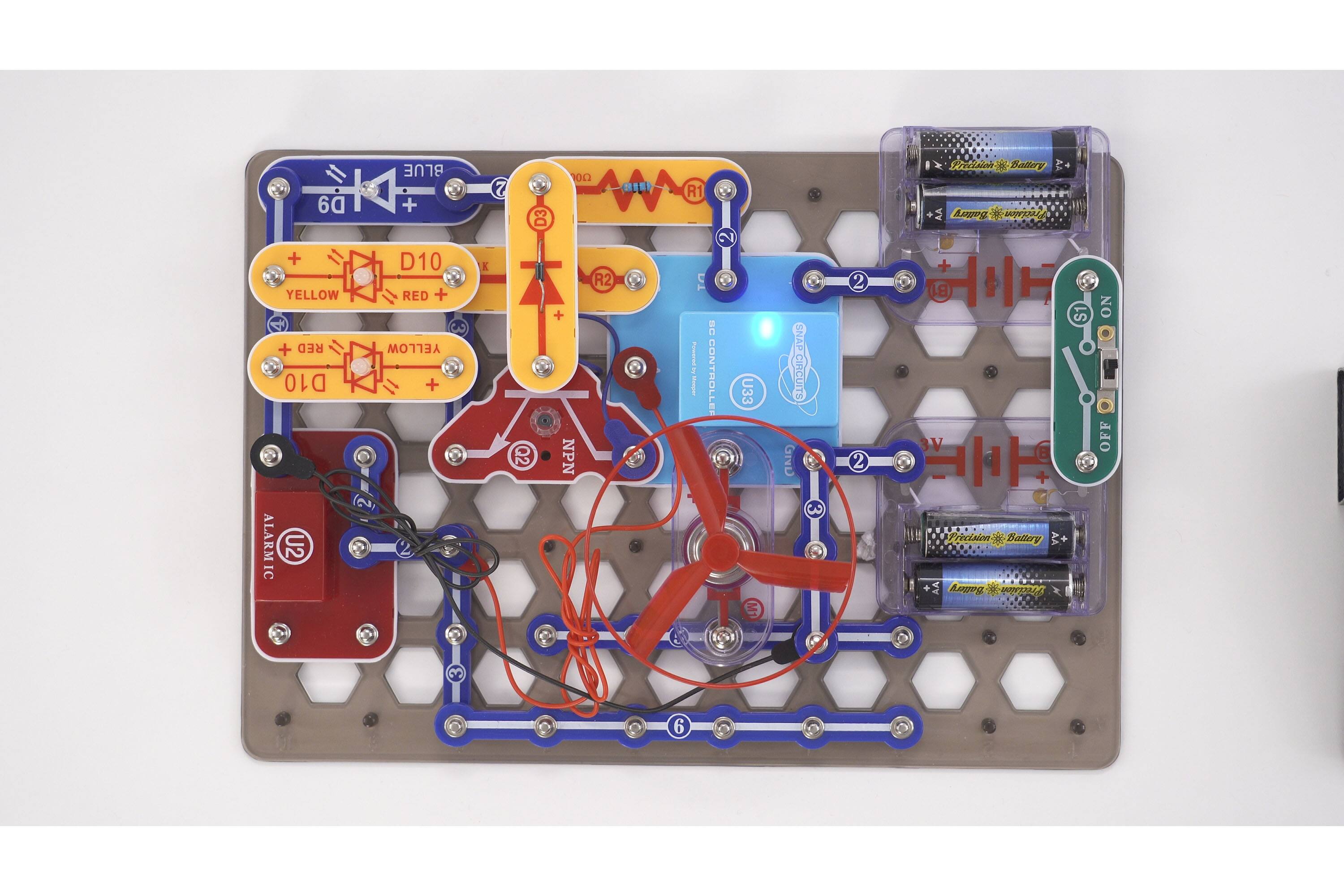 The text on the image is already grouped and correctly labeled. The image shows a circuit board with various components, including resistors, capacitors, and a battery. The components are connected to a microcontroller, and the circuit board is designed to control a device. The image also includes a diagram of the circuit board, which helps to understand the connections and functions of the components.