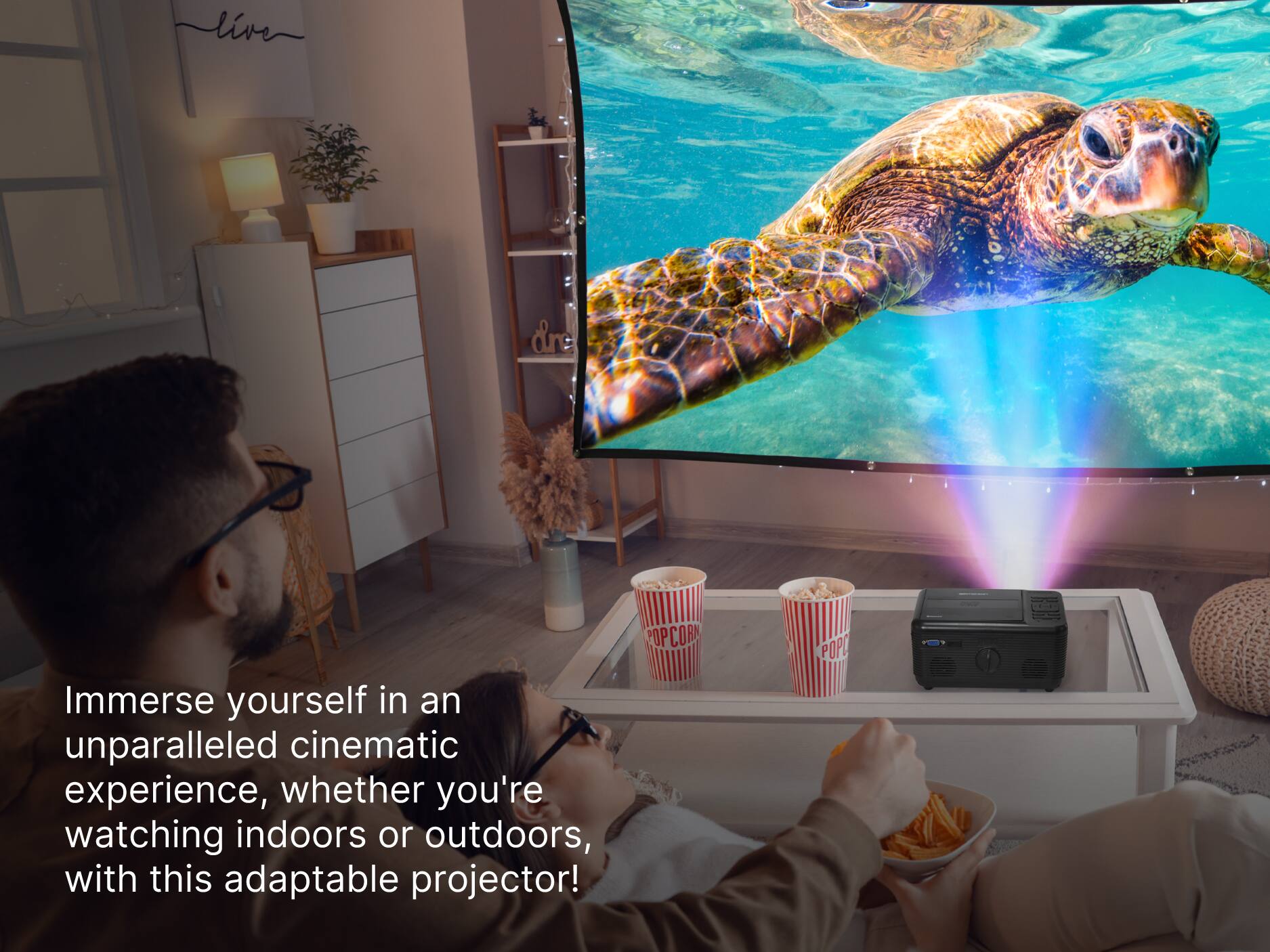 POPCORN | Immerse yourself in an unparalleled cinematic experience, whether you're watching indoors or outdoors, with this adaptable projector!