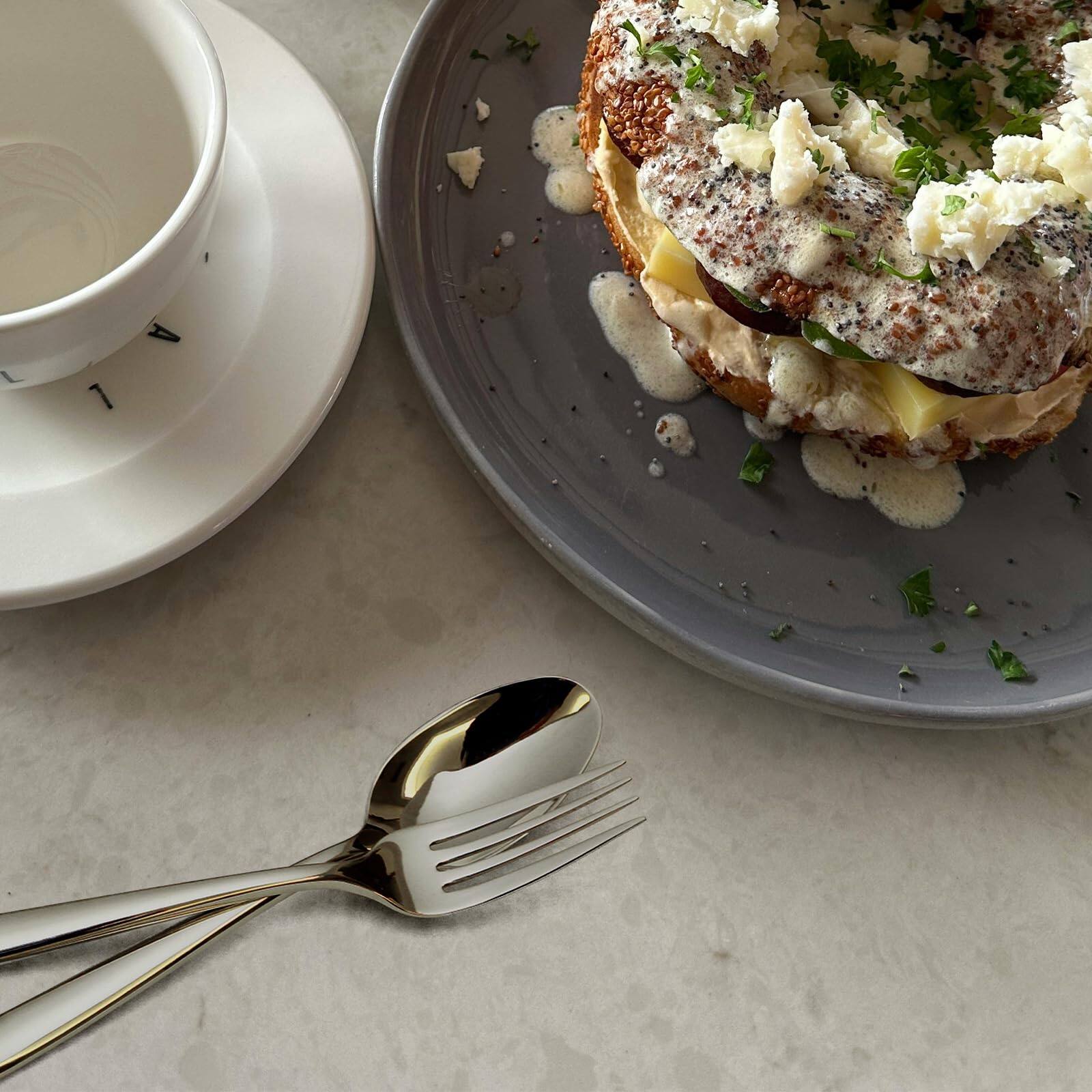 Left. Dazzed Corner - 20-Piece Silverware Set, Glossy Stainless Steel Flatware Service for 4 - NY8JPSC.