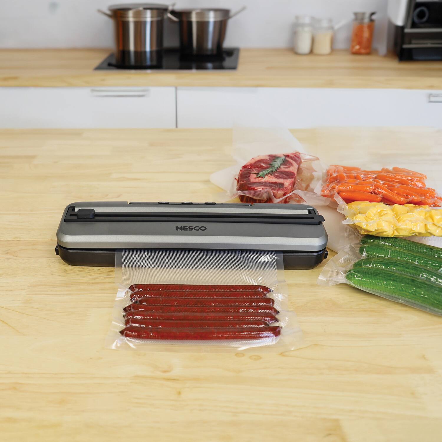 Left. Nesco - 100-Watt Compact Vacuum Sealer VS-74S - Silver.