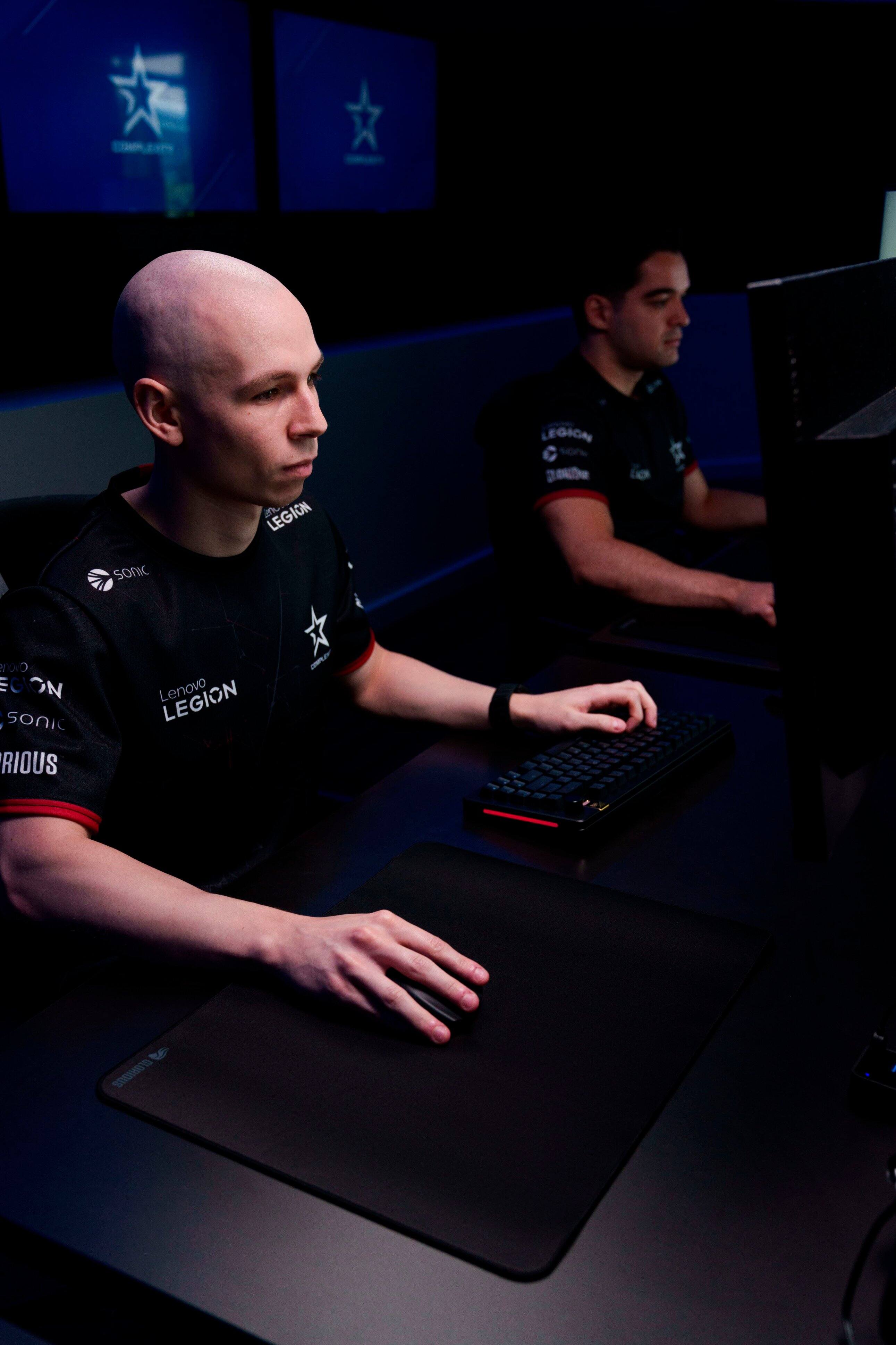 The text on the image reads "LEGION 3 LEGION 10 De Sonic OVO EGION SOnic RIOUS Lenovo LEGION - te R001S." This text is likely a combination of different elements such as product names, brand names, and possibly a reference to a gaming event or tournament. The text is not coherent or organized, so it is difficult to understand its intended meaning.