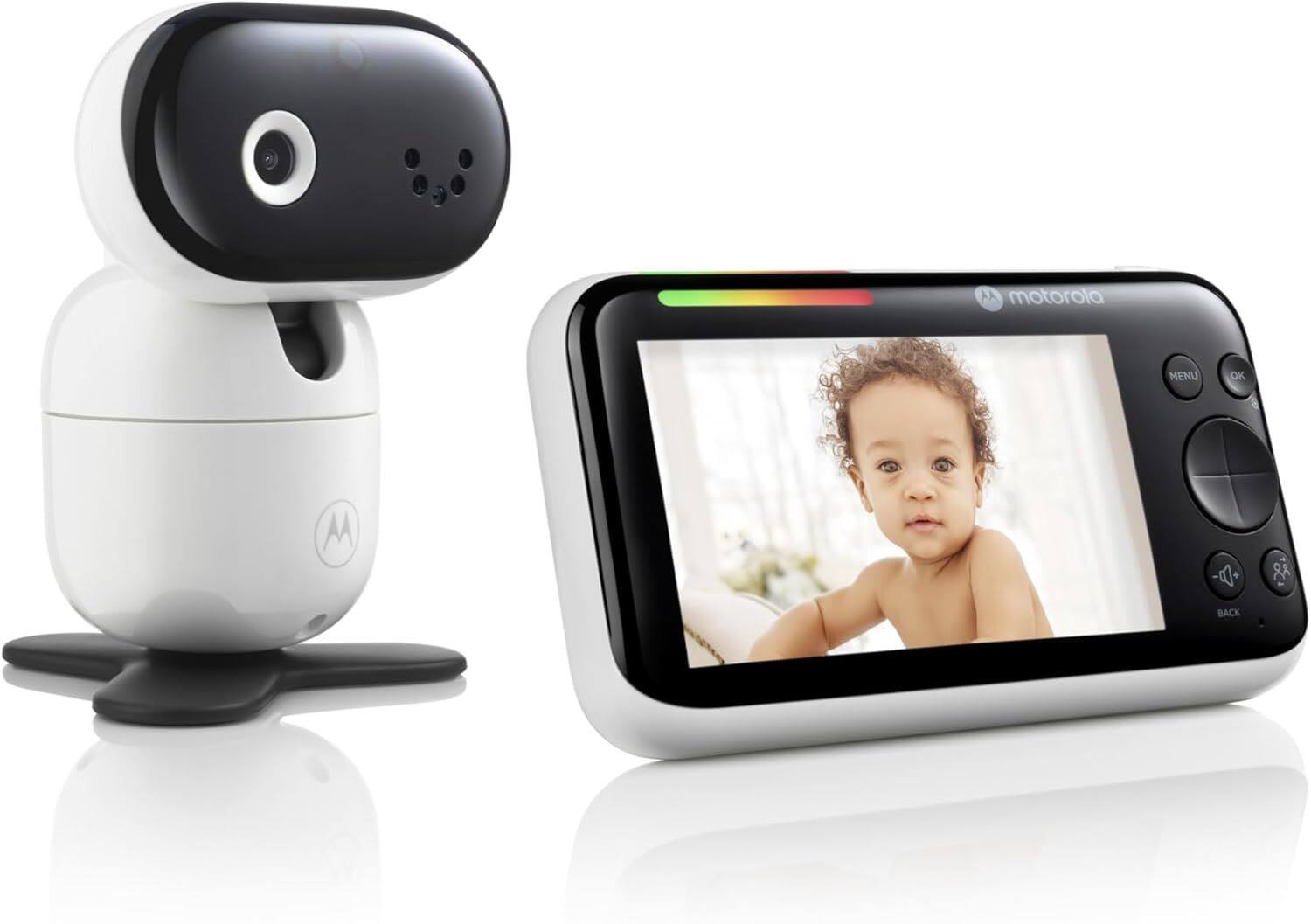 A Motorola camera with a screen showing a baby. The camera has buttons labeled MENU, OK, and BACK.