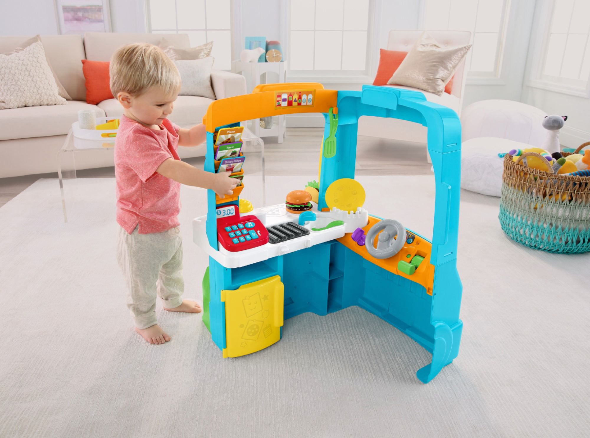 Left View: Fisher-Price Laugh & Learn Servin’ Up Fun Food Truck Electronic Activity Center for Toddlers