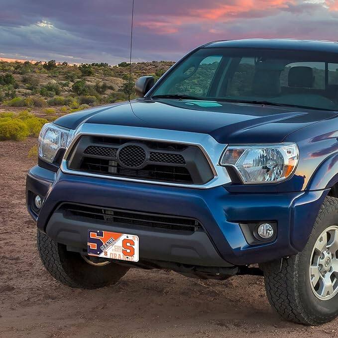 The text on the license plate reads: "5 ORANGE CUS DRAN"