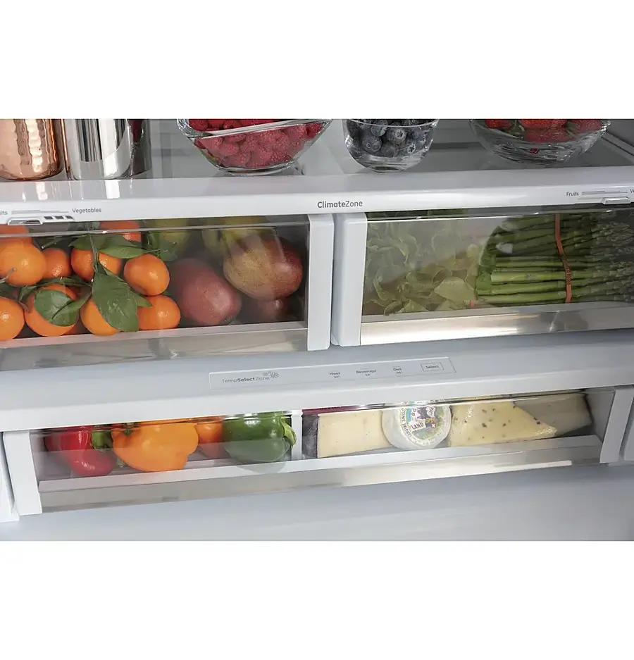 The image displays a refrigerator with two drawers, each filled with various fruits and vegetables. The refrigerator is stocked with a variety of items, including apples, oranges, and broccoli. The apples are placed in the upper left section of the refrigerator, while the oranges are located in the upper right section. The broccoli can be found in the middle-right section of the refrigerator. The refrigerator is well-organized and ready to be used for meal preparation.