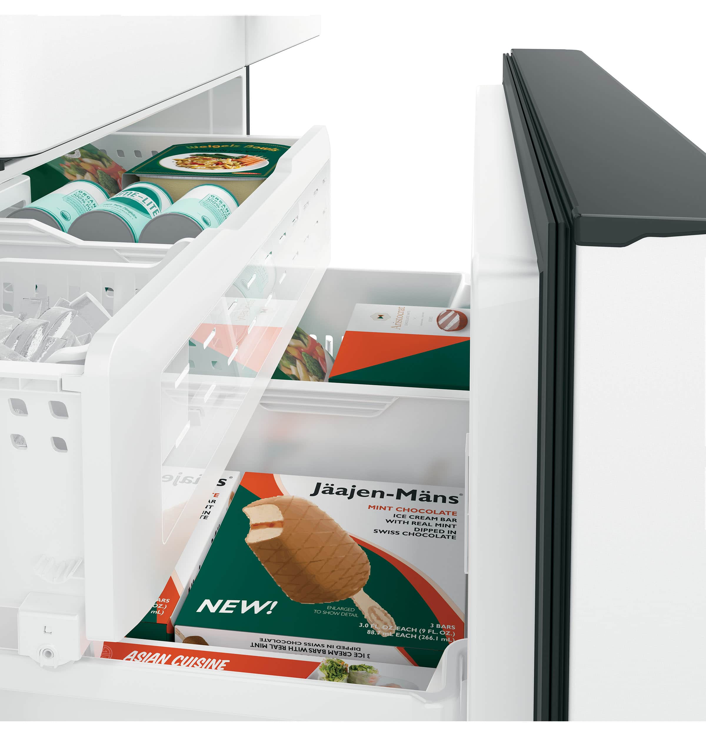 The image shows an open refrigerator with various food items inside. There are two packages of ice cream, one of which is mint-flavored, and a package of chocolate mint cream. The refrigerator also contains a container of yogurt and a bottle of soda. The refrigerator is white, and the food items are neatly arranged inside.