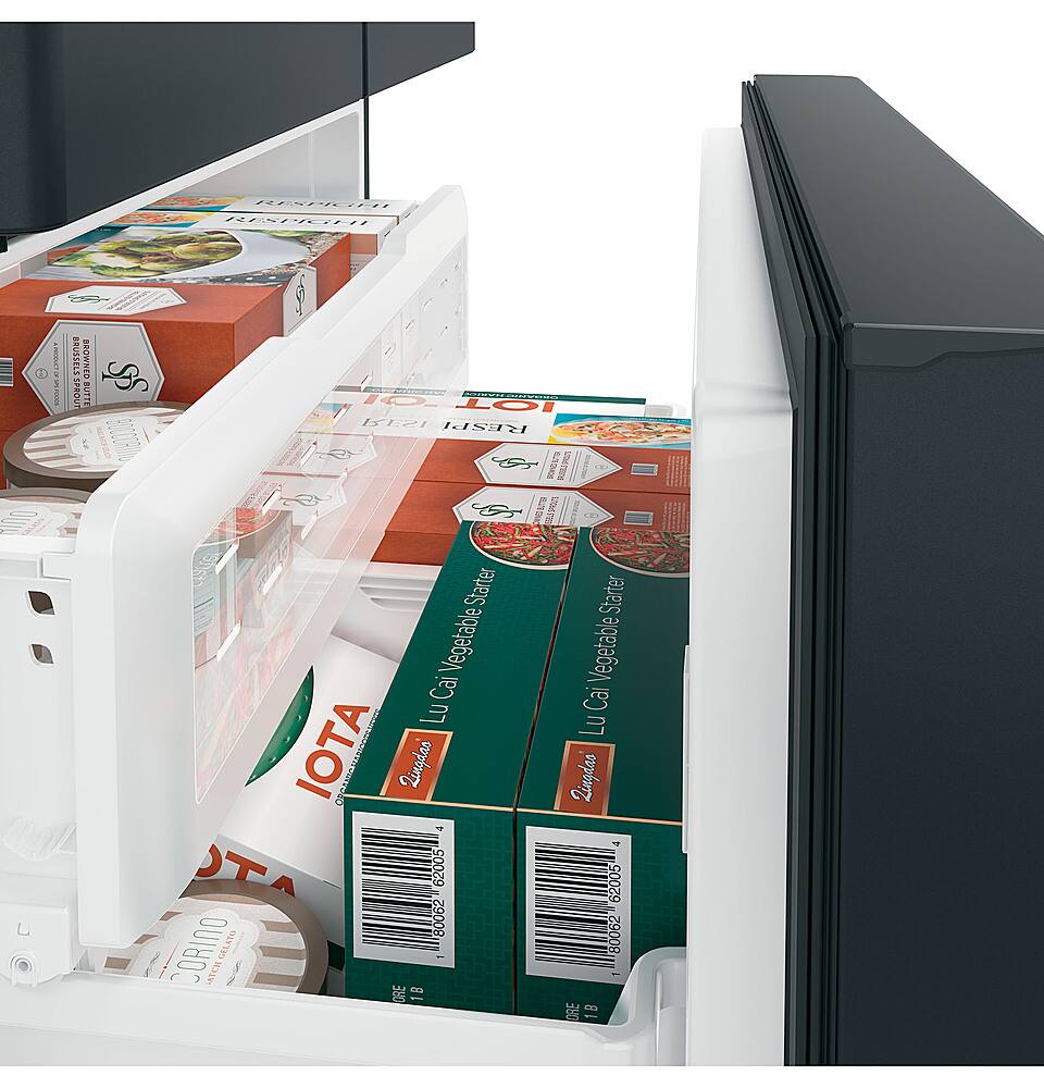 The image shows a refrigerator with its door open, revealing a variety of food items inside. There are multiple bottles of different sizes and shapes, as well as a few bowls. The refrigerator is filled with a diverse assortment of food, including a box of broccoli, which is placed in the middle of the fridge. The refrigerator door is open, allowing the viewer to see the contents inside.