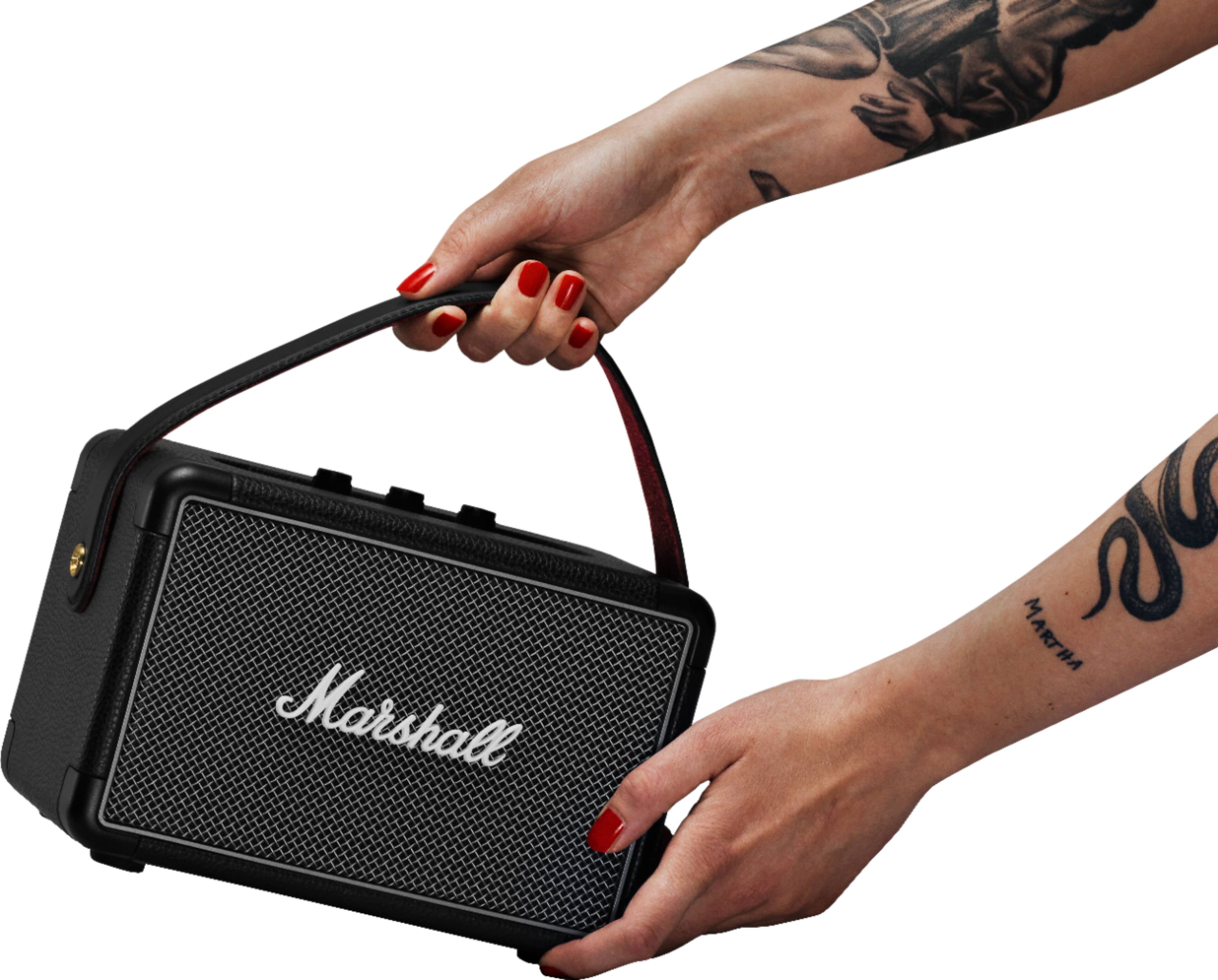 Marshall is the brand of the speaker in the image.