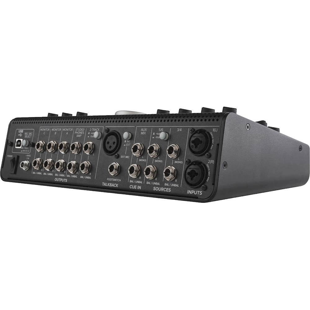 The text on the image reads:

"I-9 SC MONITOR MONITOR STUDIO 2-TRACK : 8 4 PHONES I - A a . EXT AUX MC 5/5 a H ID 3/44 1) I - LABA M UNDL - UNBAL OUTPUTS EXT M 4 MONO L (MONO MONO 2(R) XANO . FOTSWTCH A i BA UNRAL g BAL UNDAL TALKBACK BAL /UNBAL CUE IN SOURCES INPUTS"

This text appears to be a description of a sound mixing board, which is designed for studio use and has multiple inputs and outputs for connecting various audio sources. The board is equipped with 8 phones, 4 balanced outputs, and 4 mono inputs, as well as a talkback feature for communication between the engineer and the performers. The board also has a built-in cue system for monitoring audio sources and a switch for selecting between balanced and unbalanced inputs.