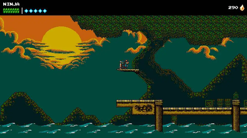 The image shows a video game scene with a ninja character standing on a bridge over a river. The ninja is holding a sword, and there is a sunset in the background. The game is set in a dark environment, with the sunset casting a warm glow over the scene. The ninja appears to be the main focus of the image, and the game seems to be a mix of action and adventure elements.