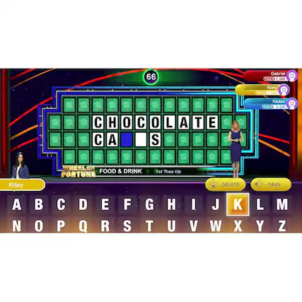 The image features a game show with a woman standing in front of a large board displaying the word "chocolate cakes." The game show is called "Wheel of Fortune." The woman is wearing a black dress and is standing next to a large letter board. The letters are arranged in a way that spell out the word "chocolate cakes." The game show is likely a popular TV show where contestants try to solve puzzles and win prizes. - E (Everyone)