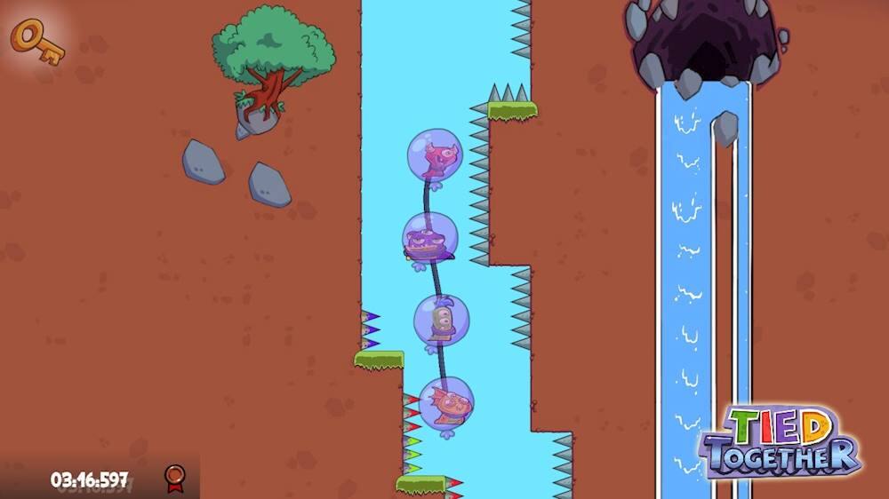 The image shows a video game with a character standing next to a river filled with bubbles. The game appears to be a platformer, with the character navigating through the water and possibly avoiding obstacles. The text "TIED TOGETHER" is visible at the bottom right corner of the image, likely indicating a cooperative gameplay feature.