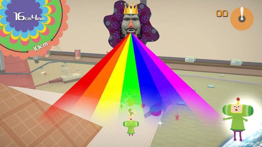 The image features a video game with a colorful rainbow and a character wearing a crown. The game is set in a large room with a rainbow-colored background. There are also two characters in the scene, one of which is wearing a crown. The game appears to be a fun and engaging experience for players.