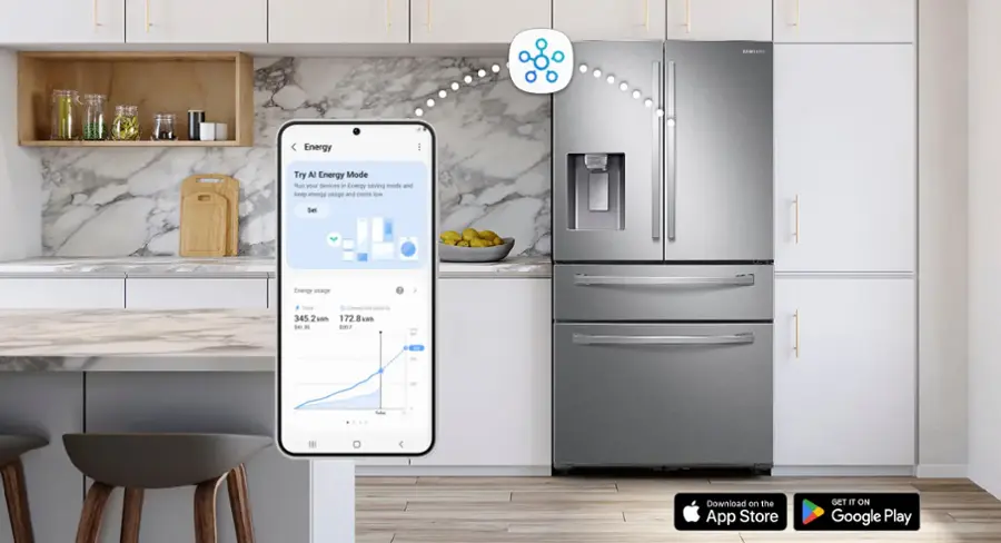 The image features a kitchen with a large metallic refrigerator and a cell phone. The cell phone is displaying a graph showing energy usage for the refrigerator. The refrigerator is positioned in the middle of the kitchen, and there is a bowl on the countertop nearby. The kitchen also includes a sink and a dining table with chairs. The scene is set in a modern kitchen with a focus on energy efficiency and monitoring.