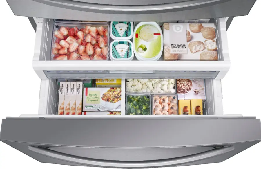 The image features a large refrigerator with its door open, revealing a well-stocked interior. The refrigerator is filled with various food items, including several bottles of drinks and a variety of vegetables. There are also multiple bowls containing different types of food. The refrigerator is organized in a way that allows for easy access to the items, making it a convenient and functional appliance for storing and preparing meals.