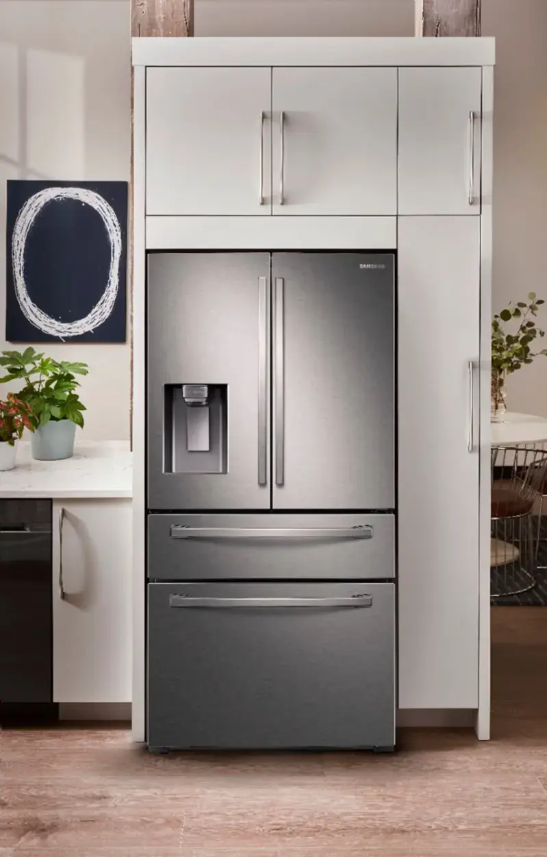 The image features a fingerprint resistant surface, which is designed to prevent fingerprints from being left on the surface. This is particularly useful in high-touch areas, such as refrigerator doors, where fingerprints can be easily visible and may require frequent cleaning to remove. The fingerprint resistant surface is made of stainless steel, which is known for its durability and resistance to stains and fingerprints.