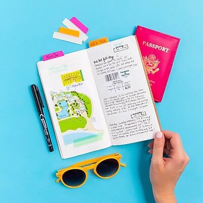 Sure, here is the corrected and grouped text:

**Passport:**
- PASSPORT

**Travel Journal:**
- Werk Ove F TRO iet l day
- Nahe Kai
- otrs RLOT

**Stickers:**
- 100% NATURAL
- 100% NATURAL

**Other Text:**
- (Text on the map and handwritten notes in the journal)