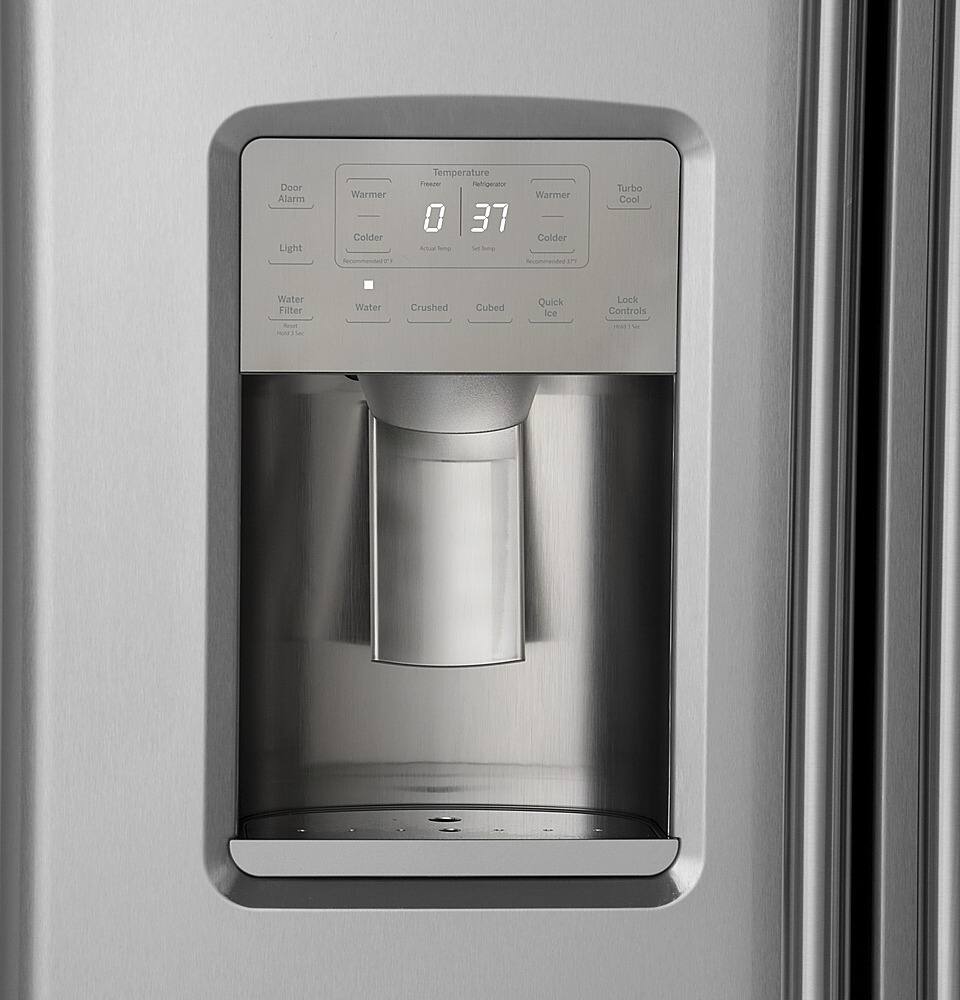 The image features a stainless steel refrigerator with a water and ice dispenser on the door. The dispenser has a digital display that shows the current temperature of the water and ice. The display also indicates whether the water is cold, room temperature, or warm. The refrigerator is equipped with a water filter and ice dispenser, providing users with easy access to cold, room temperature, and crushed ice. The door alarm light is also visible, indicating when the refrigerator door is open.