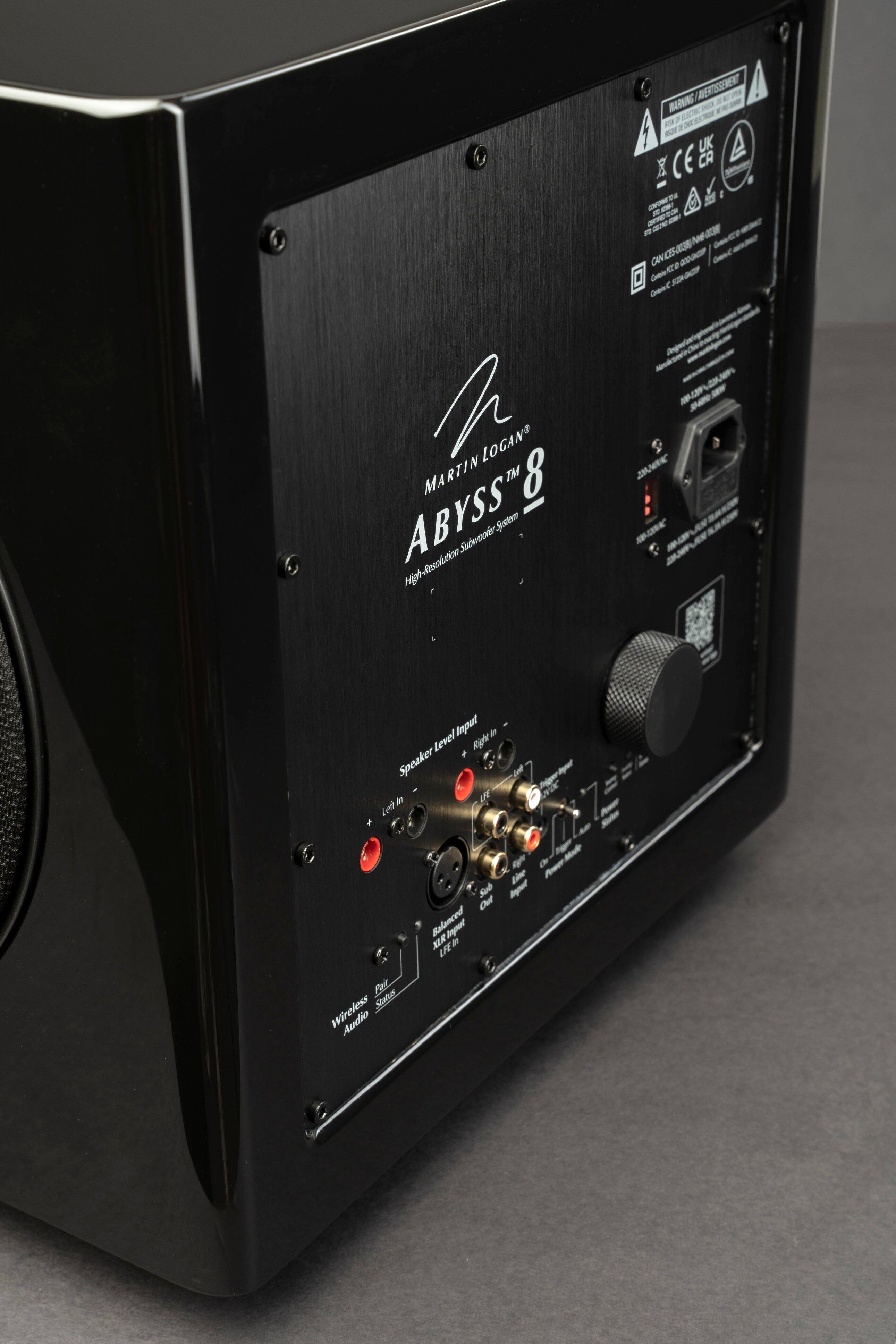 The text on the image reads: "MERTSSEMEN! BON G 1 eu UK CE CA - - - - S-3E-CN Gen22000 Ae e DenC LOGAN MARTIN TM 8 ABYSS Subwoaer Sustw Hih-Resolution JANC MRK Ieput # Level Agh Speaker -  ten Led -  Um -l de Die S Mpul Out Ralanced MIR IR #e Pai Statur Wireless Audio."