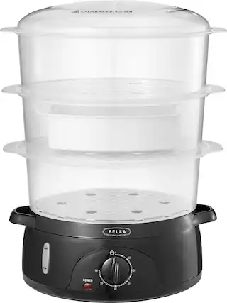 The image shows a Bella food processor with a clear lid and a black base. The machine is empty, with no food inside. The lid is open, revealing the empty interior. The food processor is designed for various tasks, such as chopping, mixing, and blending, and it is suitable for both small and large batches. It is important to follow the manufacturer's instructions and safety guidelines when using the appliance to ensure proper operation and prevent accidents.