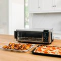 Alt View Zoom 1. Ninja - Foodi 8-in-1 Digital Air Fry Oven, Toaster, Flip-Away Storage, Dehydrate, Keep Warm - Stainless Steel/Black.