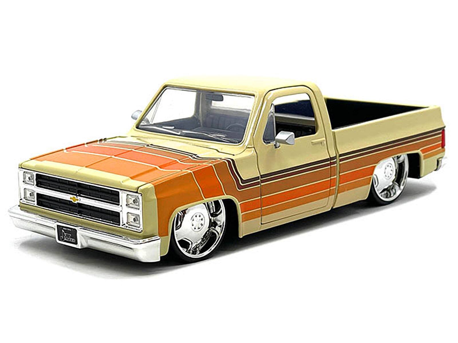 Angle. Jada - 1985 Chevrolet C-10 Pickup Truck Beige with Stripes and Lowenhart Wheels "Just Trucks" Series 1/24 - Beige .
