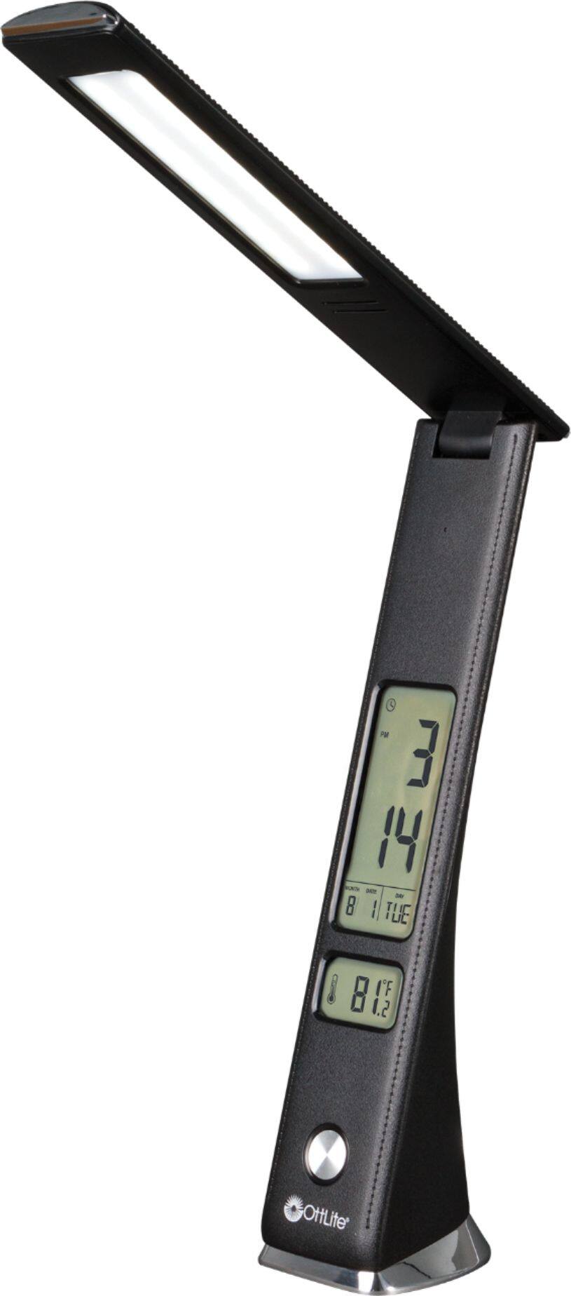 The text on the image reads: "PM 3 14 - 8 I TUE 8 I'F 1.2 OttLite." This text is grouped as follows:

1. "PM 3 14 - 8 I TUE" - This is a time and temperature display, indicating that the temperature is 14 degrees Celsius and the time is 3 PM.
2. "8 I'F 1.2 OttLite" - This is a brand name, likely associated with the device or product.