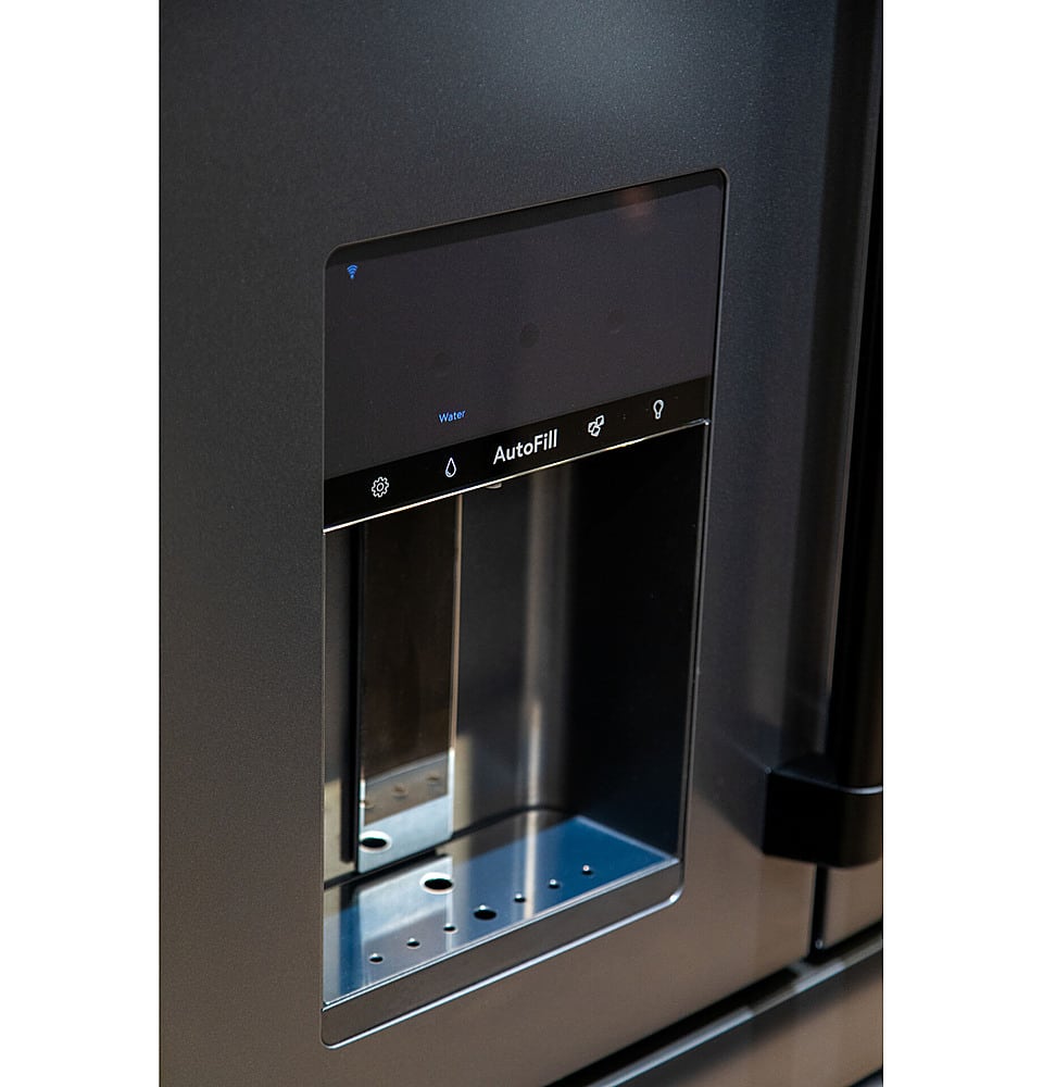 The image features a water dispenser, which is a part of a refrigerator. The dispenser is designed to provide water on demand, and it is currently displaying the message "Water AutoFill 0." This suggests that the water dispenser is empty and needs to be filled with water to function properly. The dispenser is built into the refrigerator, making it a convenient and space-saving feature for users.