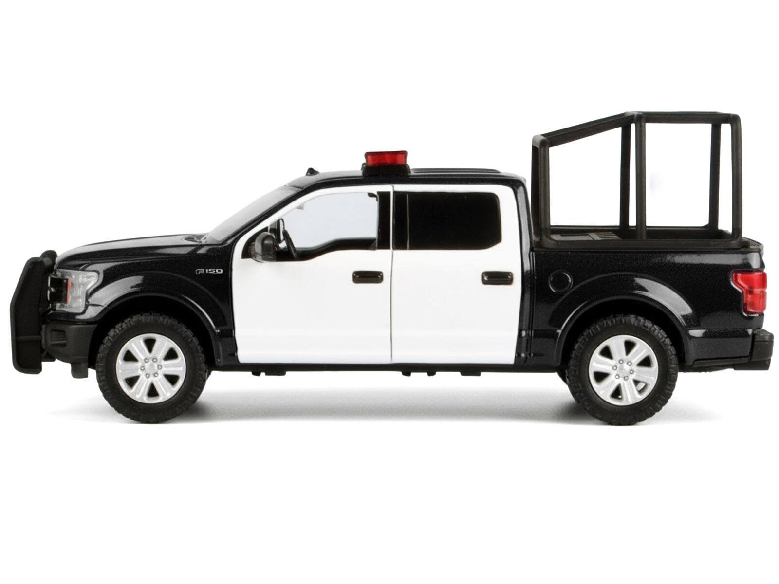 Alt View 2. Motormax - 2019 Ford F-150 Lariat Crew Cab Truck with Bed Cage Black and White with Lights and Sounds 1/27 Model Car by Motormax.