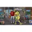 The image shows a man wearing a red shirt standing next to a robot. The robot has a green head and appears to be a part of a video game or a virtual environment. The man is also wearing jeans and seems to be interacting with the robot. There are other people in the scene, but they are not the main focus. The image captures a moment of interaction between the man and the robot, possibly indicating that the man is controlling the robot or engaging in a conversation with it.