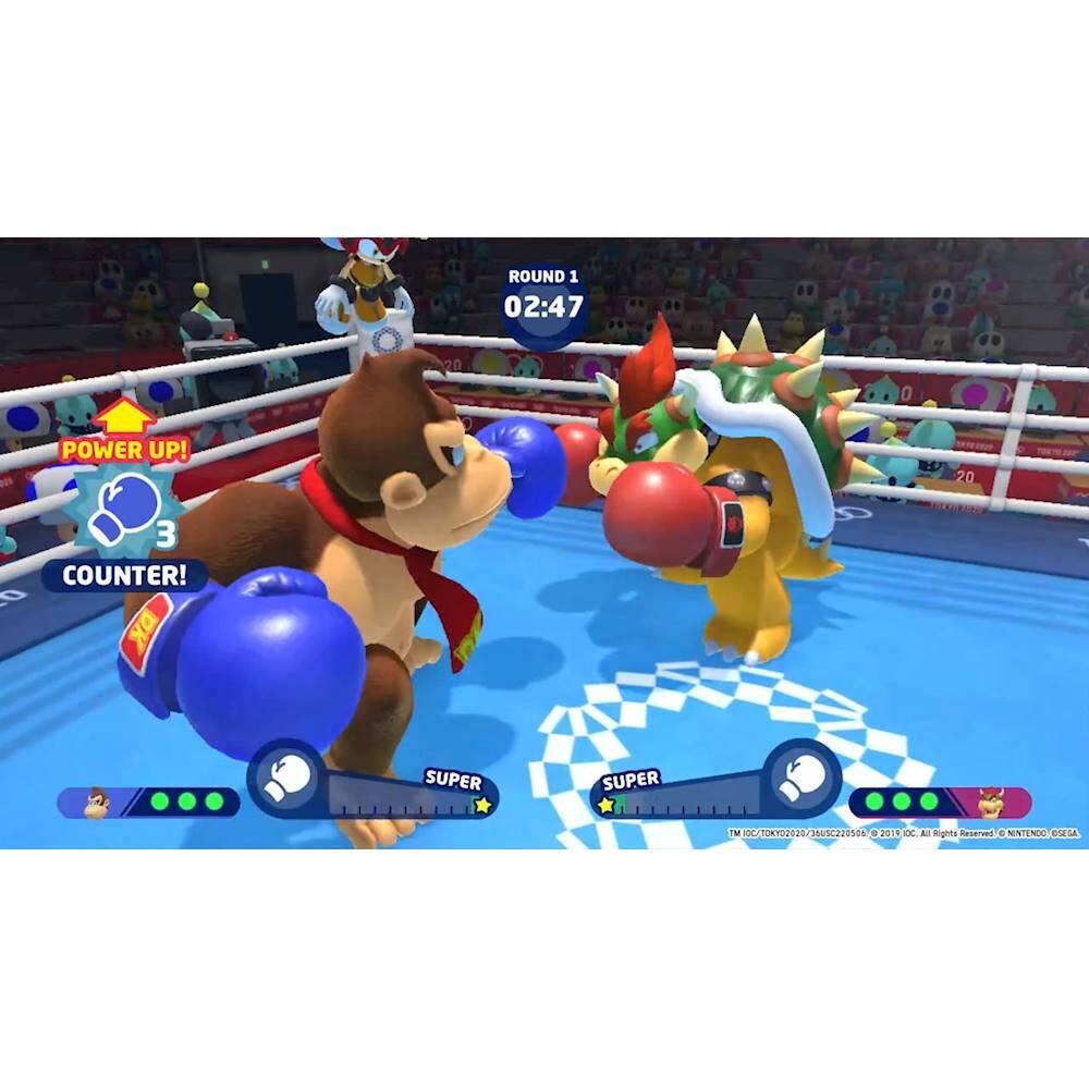 The image shows two characters, one of which is a monkey, standing in a boxing ring and holding boxing gloves. They are facing each other, possibly in the middle of a boxing match. The scene is set in a stadium, with several other characters visible in the background. The image is likely from a video game, as the characters are animated and the setting appears to be a virtual environment.