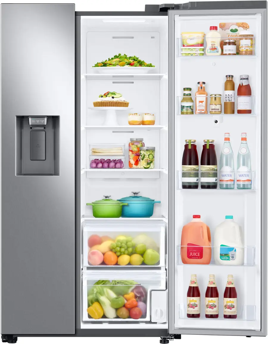 The refrigerator is filled with a variety of food and drinks. The top shelf contains several bottles, including water and juice. The middle shelf has a bowl and a cake, while the bottom shelf is filled with fruits and vegetables. The refrigerator is well-stocked and ready for use.