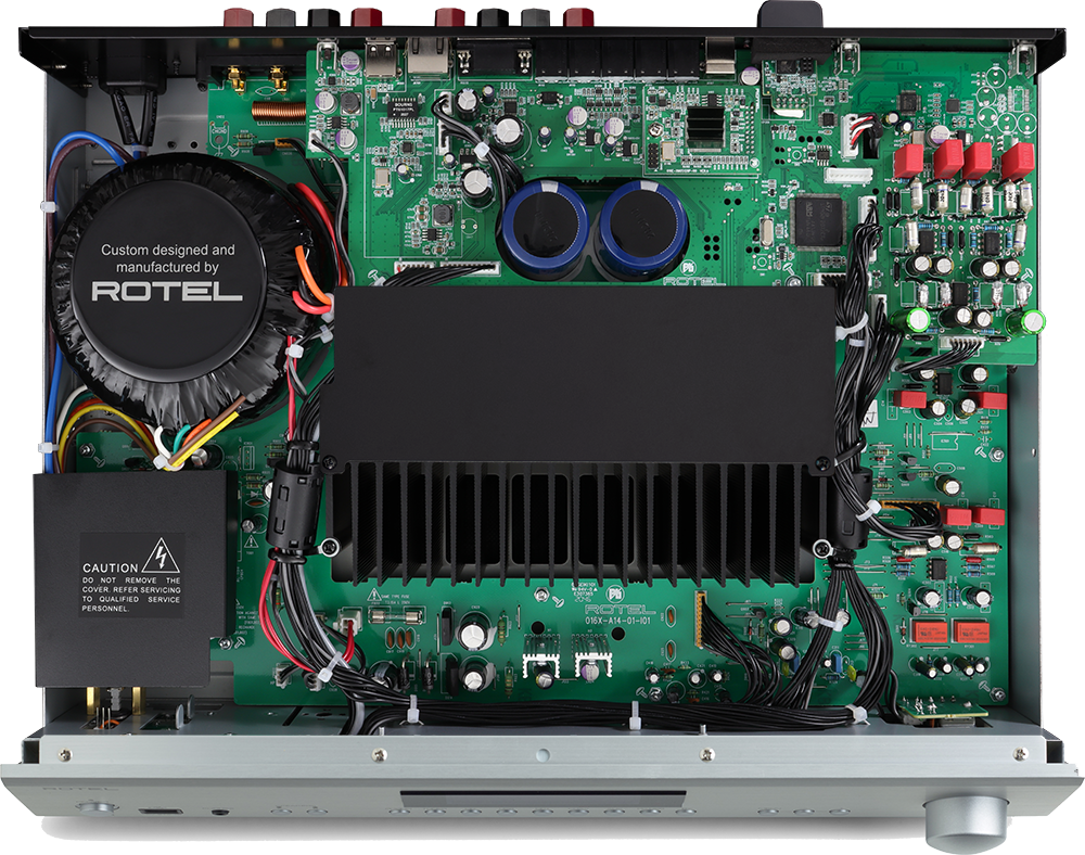 Custom designed and manufactured by ROTEL. P. Caution: Do not remove the cover. Refer servicing to qualified service personnel.