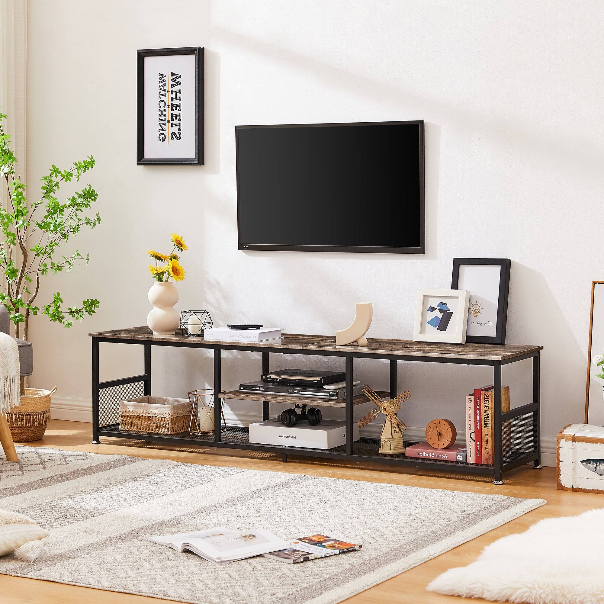 Sure, here is the corrected and grouped text from the image:

**On the Wall:**
- "21st Century"
- "Maeve"

**On the TV Stand:**
- "vitra"
- "vitra"
- "vitra"
- "vitra"
- "vitra"

**On the Books:**
- "DESIGN"
- "DESIGN"
- "DESIGN"

**On the Picture Frame:**
- "DESIGN"
- "DESIGN"

**On the Magazine:**
- "DESIGN"
- "DESIGN"

**On the Clock:**
- "vitra"

**On the Box:**
- "vitra"

**On the TV:**
- "LG"