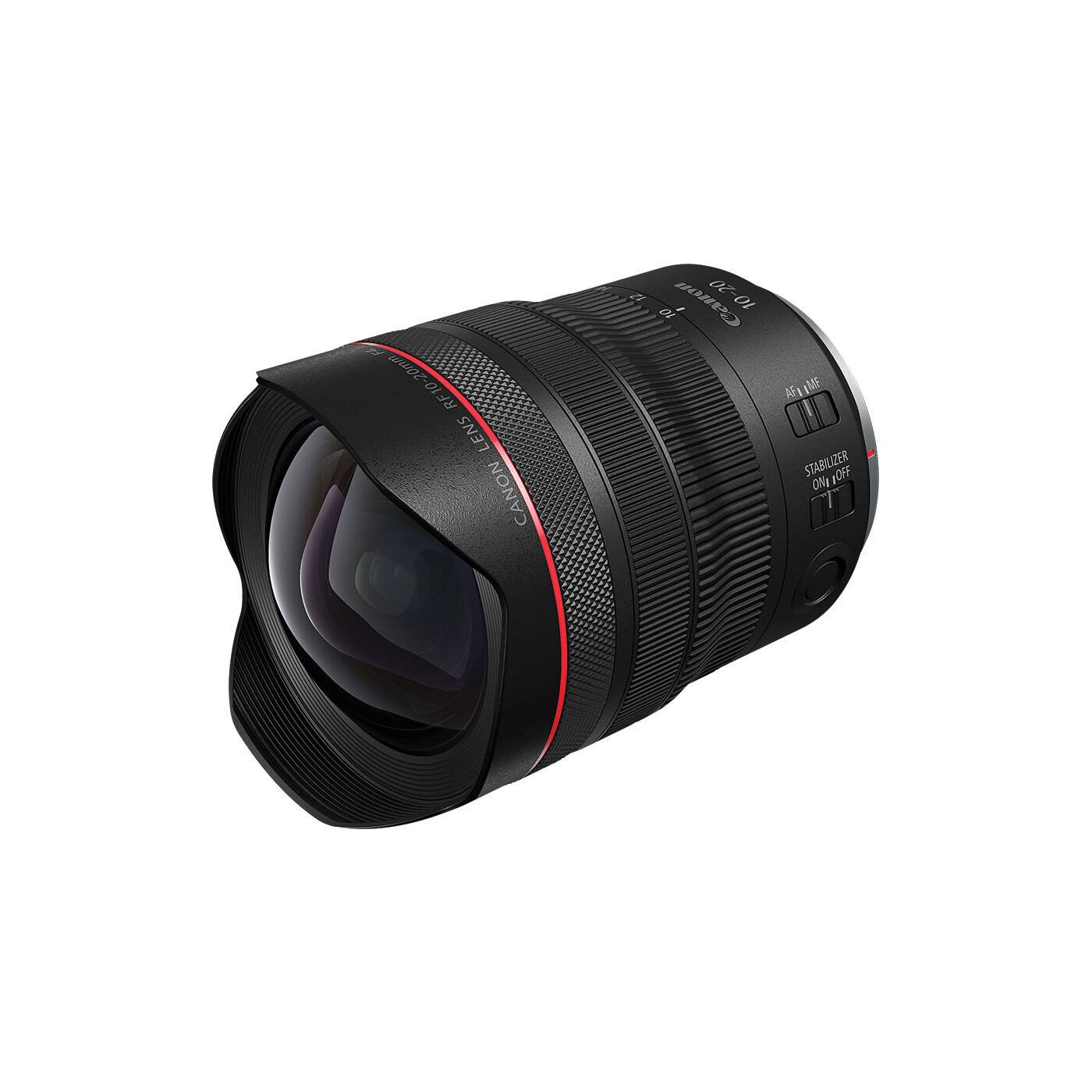 The image features a Canon RF 10-20mm f/2.8L IS USM lens, which is a wide-angle lens designed for the Canon EOS R mirrorless camera system. The lens is mounted on a Canon camera, and its aperture is set to f/2.8. The lens has a focal length of 10-20mm, making it suitable for capturing wide-angle shots and landscapes. The image also shows the lens's aperture control, which allows the photographer to adjust the aperture for different lighting conditions.