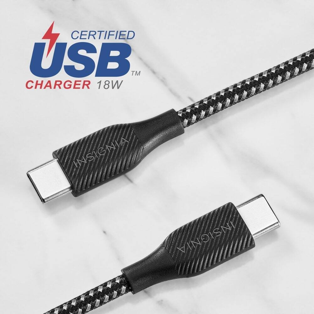 The image features two black cords, each with a USB connector at one end. The cords are placed next to each other on a white surface, possibly a marble countertop. The cords are labeled as "Certified USB Charger 18W Insignia." The USB connectors are designed for charging electronic devices, such as smartphones or tablets.