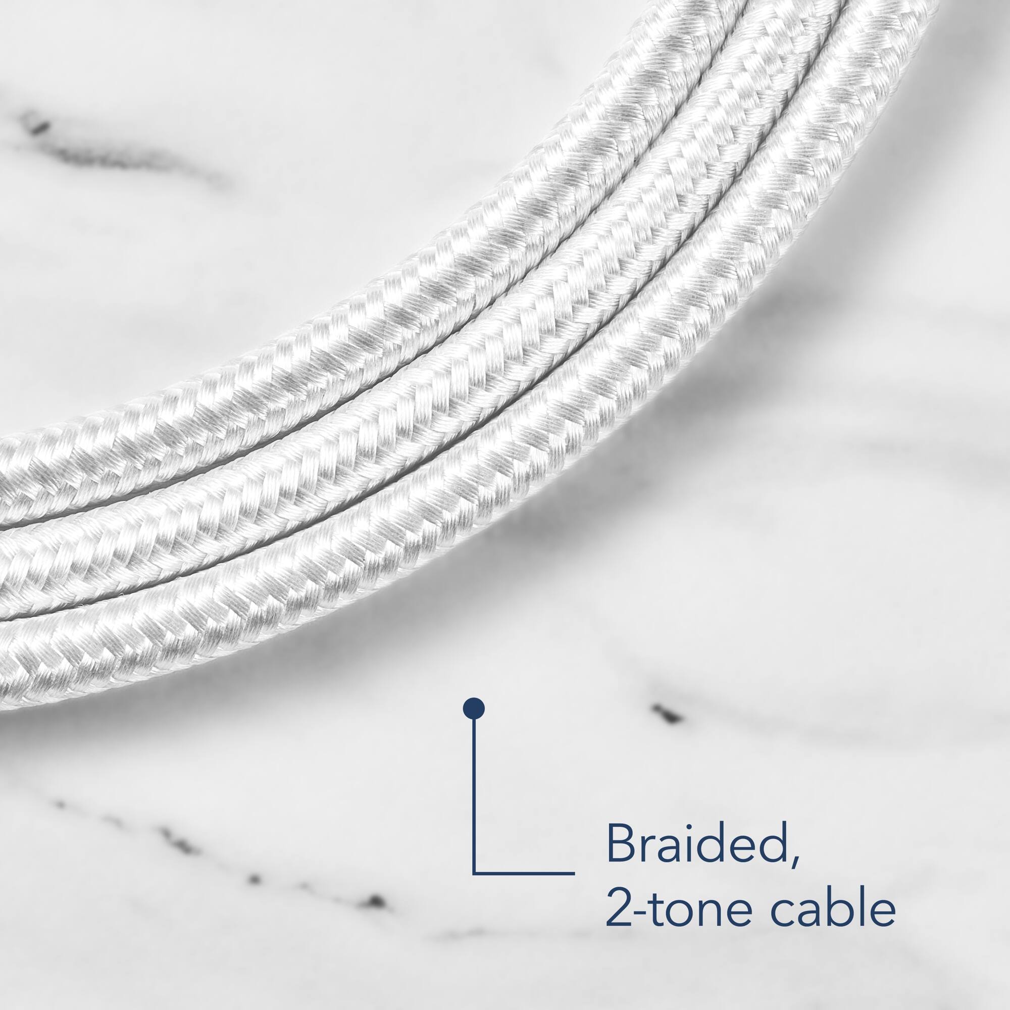 The image features a braided, 2-tone cable, which is a type of cable that has a combination of two different colors or tones. The cable is displayed on a white background, and the close-up view highlights its unique design.