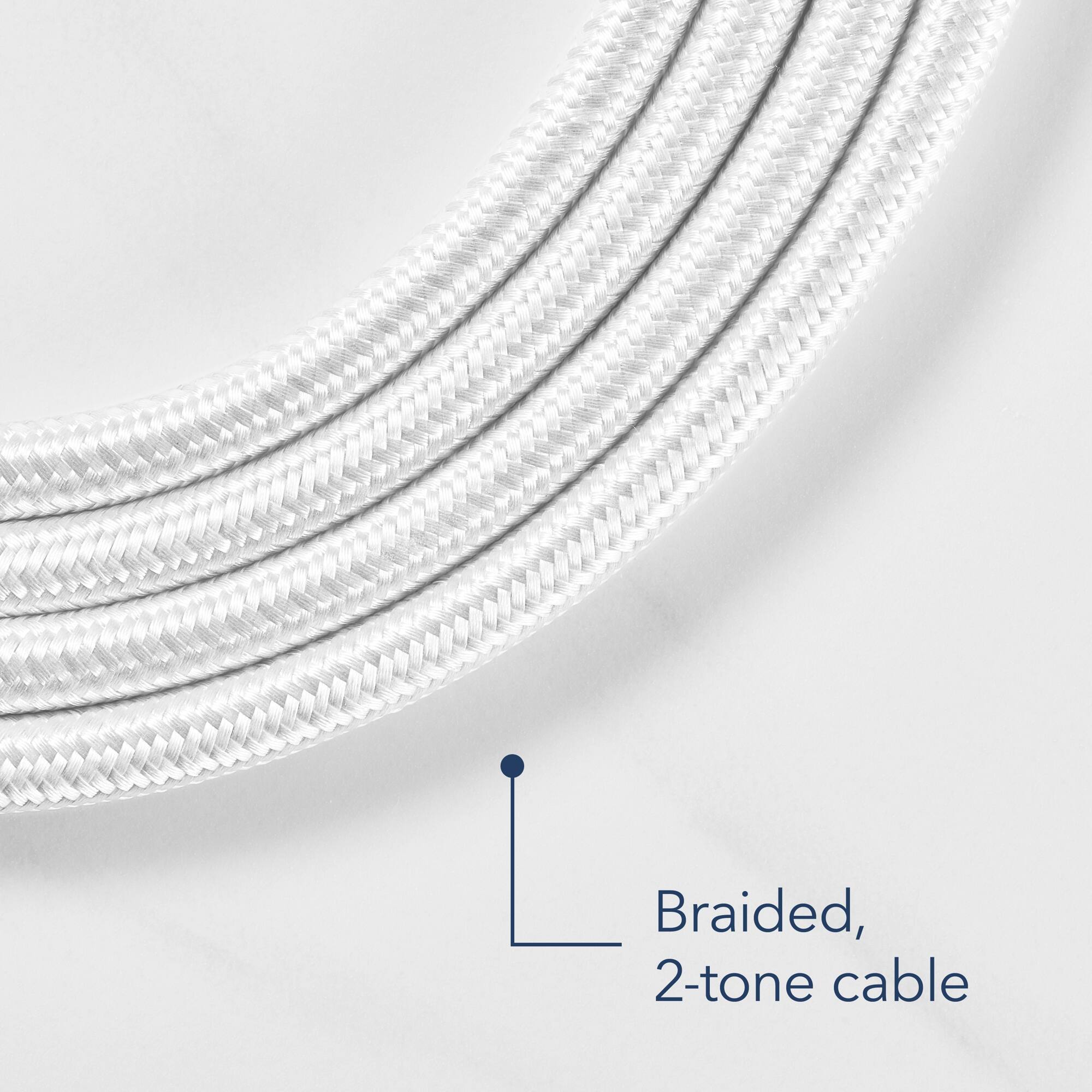 The image features a close-up view of a braided, 2-tone cable. The cable is made up of multiple strands, giving it a unique and textured appearance. The two-tone color scheme adds a touch of visual interest to the cable, making it stand out against the white background. The cable appears to be well-made and durable, making it suitable for various applications.
