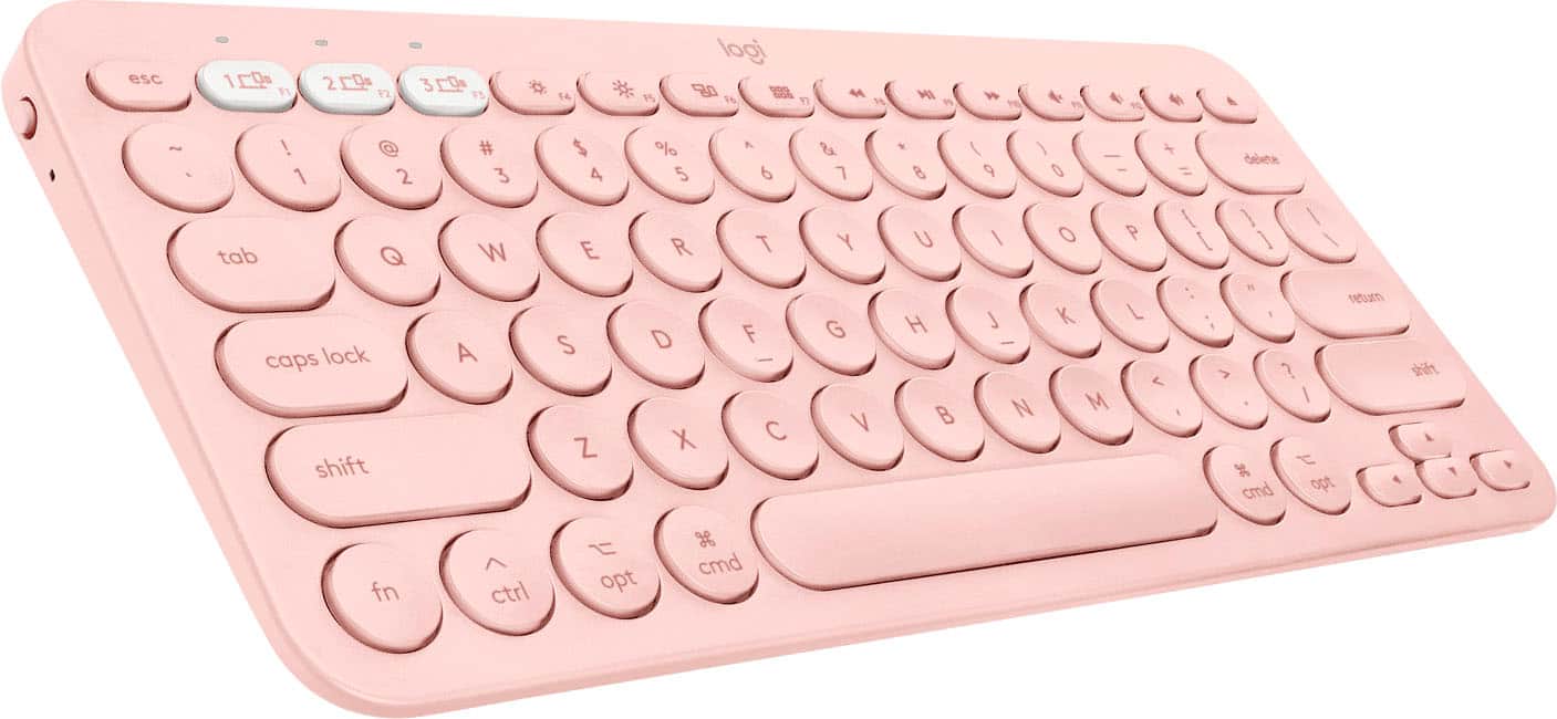 The image shows a pink keyboard with a white background. The keyboard has a number pad on the right side, and the keys are labeled with numbers and letters. The text on the image reads "esc 10 F1 29 F2 3 F5 * 1A P5 logi 80 16 17 4 F8 MI 3 W P 4 PO ~ ! @ 1 2 tab Q caps lock shift # 3 W A $ 4 E S Z % 5 R D X A 6 T F - C & Y G V * 8 U H B I - + delete 9 0 = I 1 / / O P I 1 \ W : return L K L - < > ? M I N I t 3 cmd opt shift fn ctrl opt g cmd."